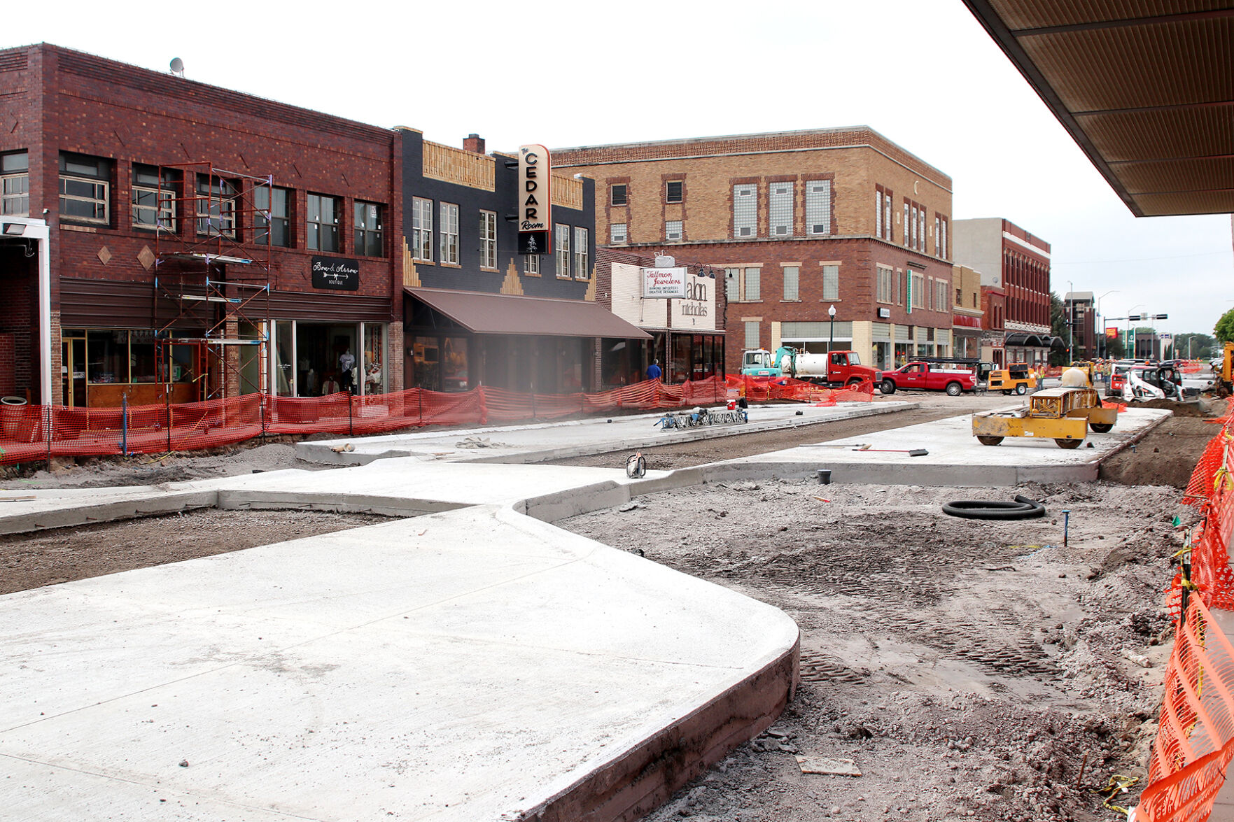 Closer to completion: Construction crews finishing concrete work along Dewey